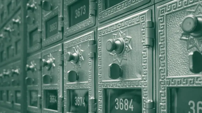 A wall of numbered post office boxes